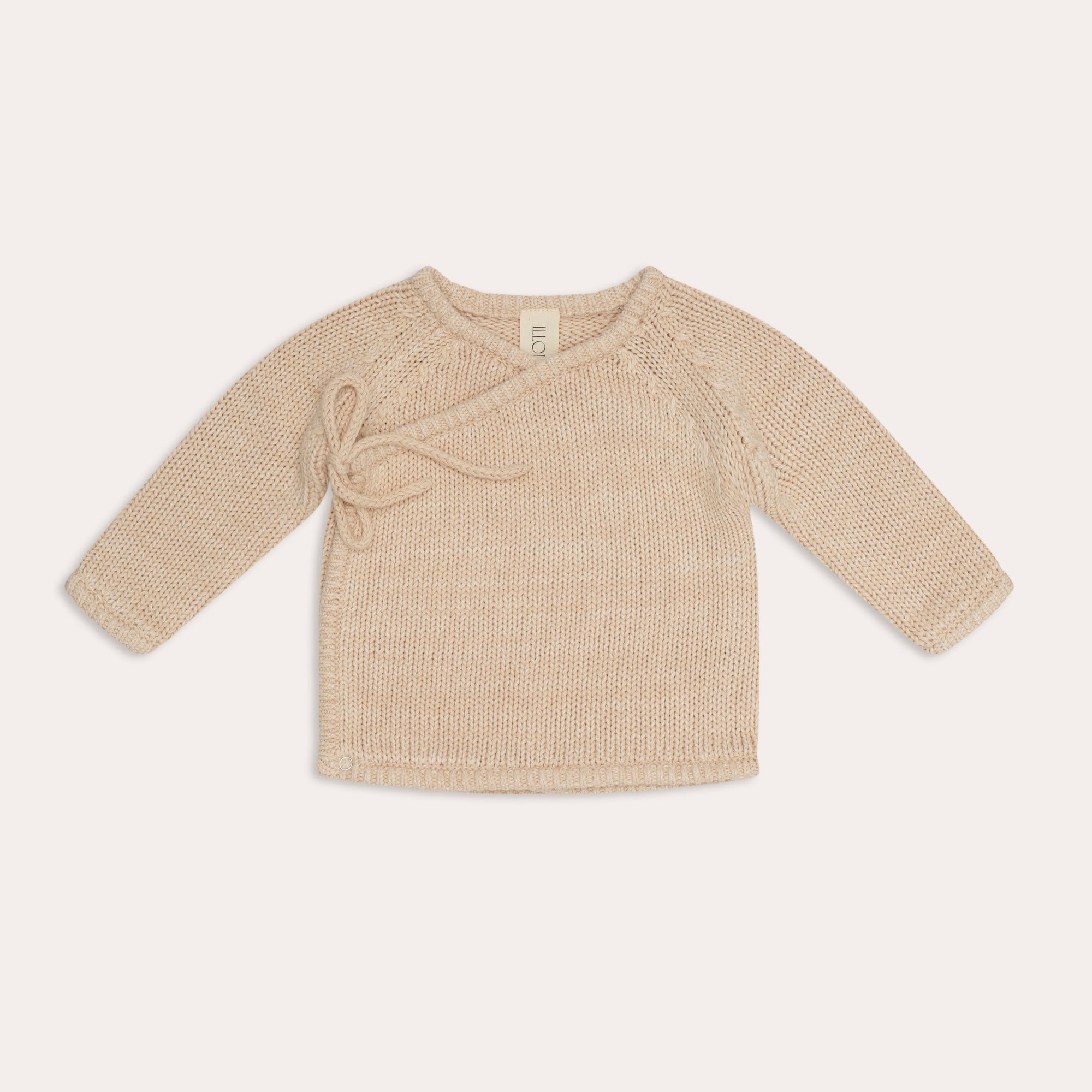 An Illoura the Label baby's knitted sweater in beige. (Product: illoura knit poet jumper | sand, Brand: Illoura the Label)