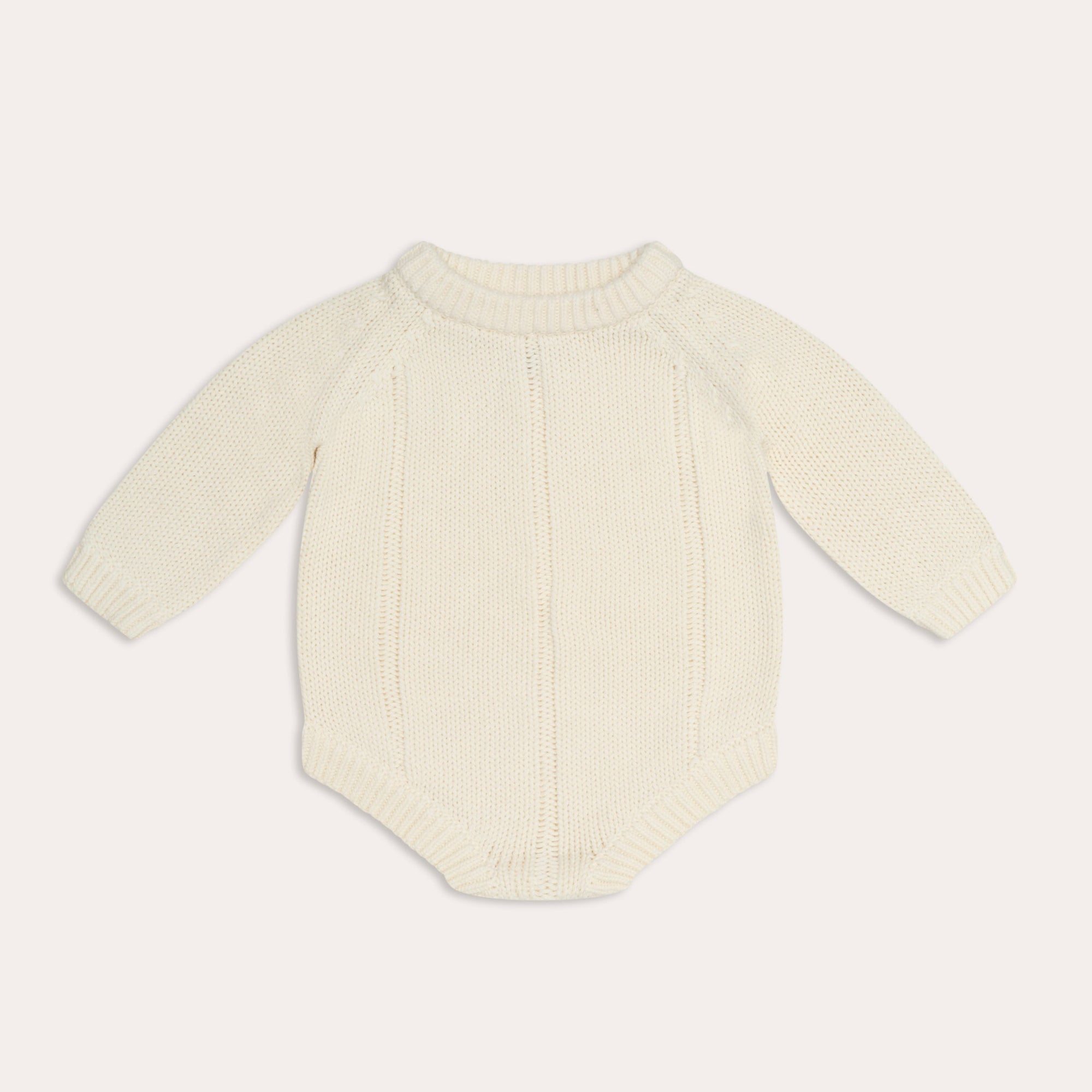 An illoura tallow knit romper | vanilla from Illoura the Label for a baby's knitted bodysuit in cream.