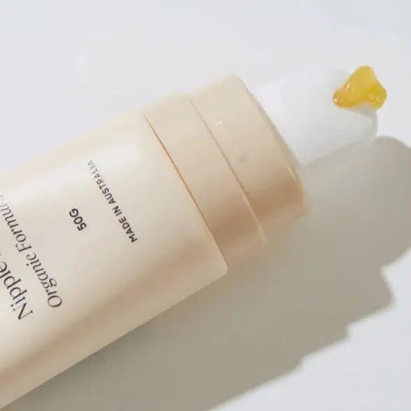 A tube of Bare Mum Nipple Balm  on a white surface, ideal for postpartum recovery and breastfeeding.
