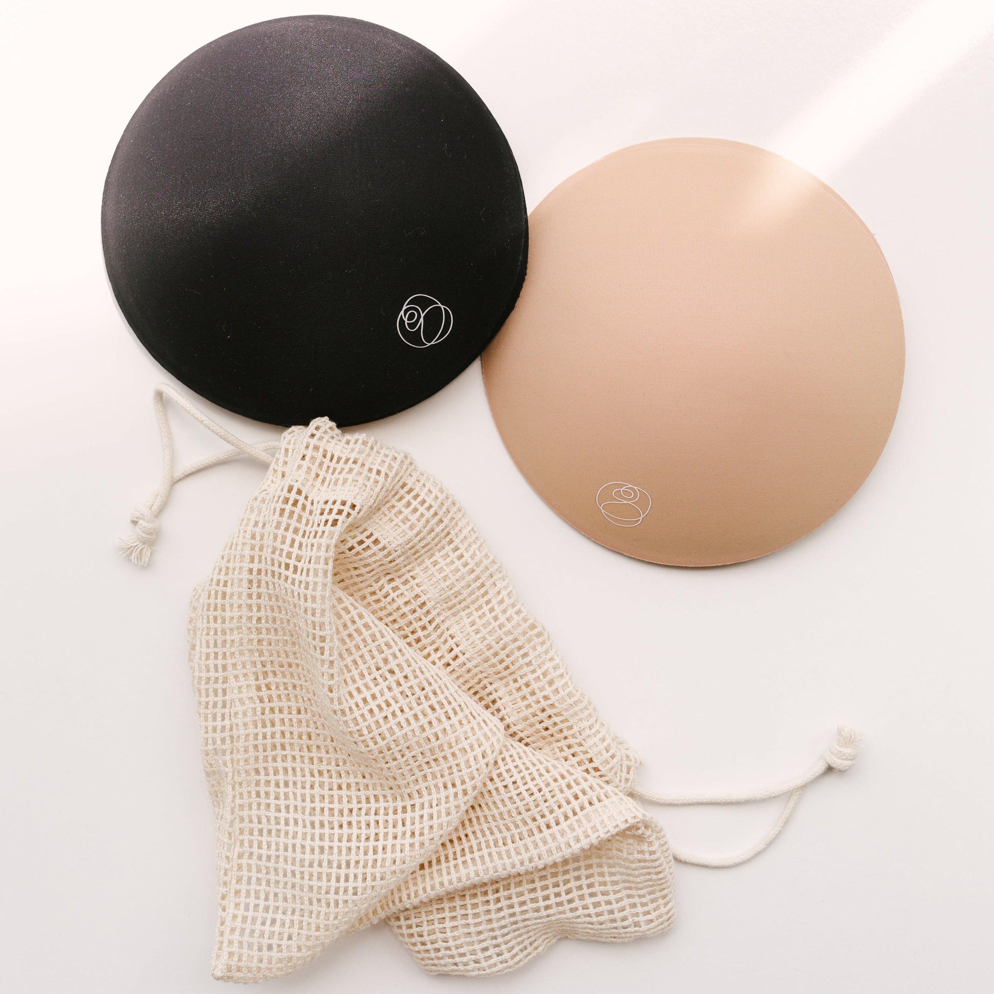 A pair of Ultra Absorbent Breast Pads by Bare Mum for postpartum mothers.