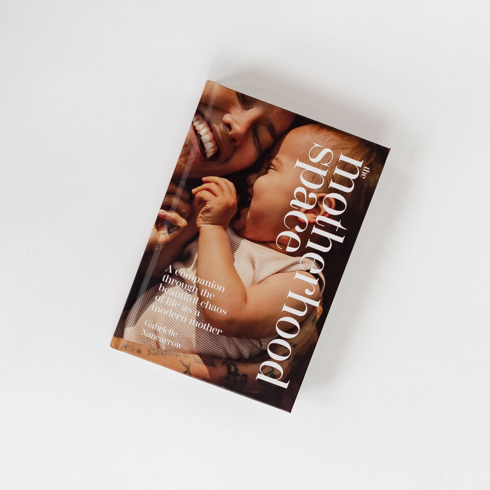 A book cover showcasing The Motherhood Space by Gabrielle Nancarrow.