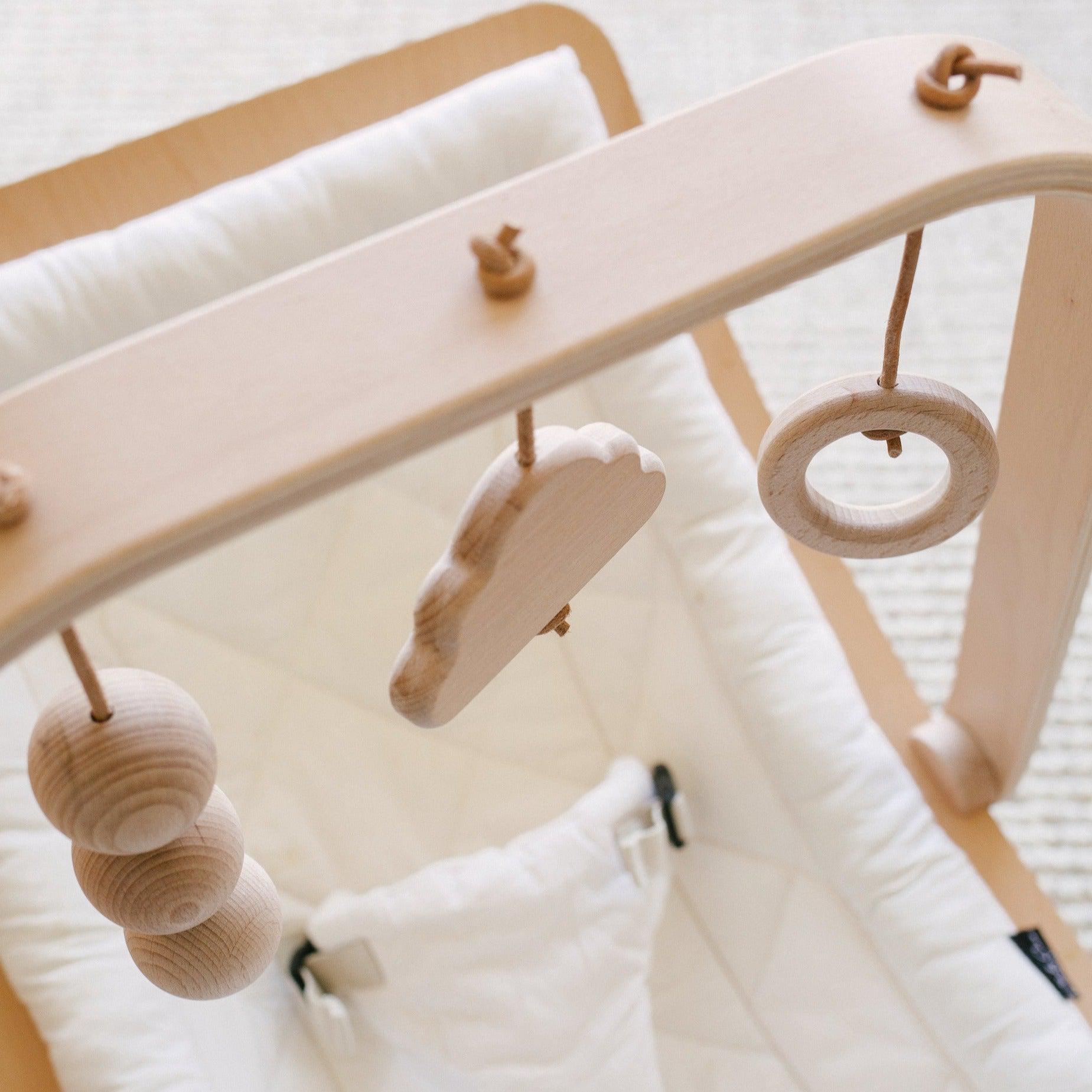 Designed especially to attach to the Charlie Crane Levo Rocker the wooden Activity Arch is ideal to stimulate babies from birth. The natural wooden toys; cloud, ring and beads will entertain your child in their Levo Rocker.