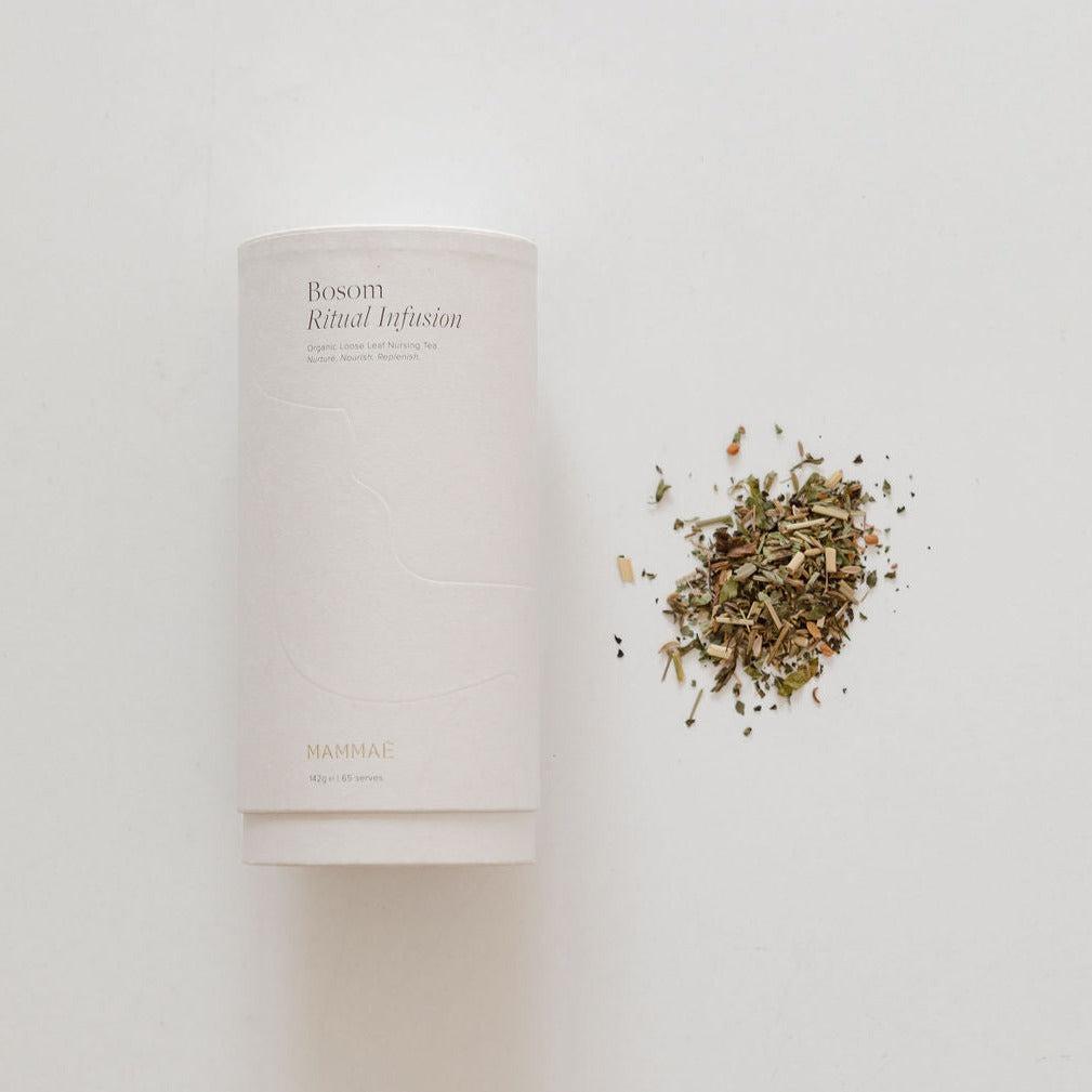 A white container with Mammae's bosom ritual infusion nursing tea, perfect for breastfeeding during pregnancy.