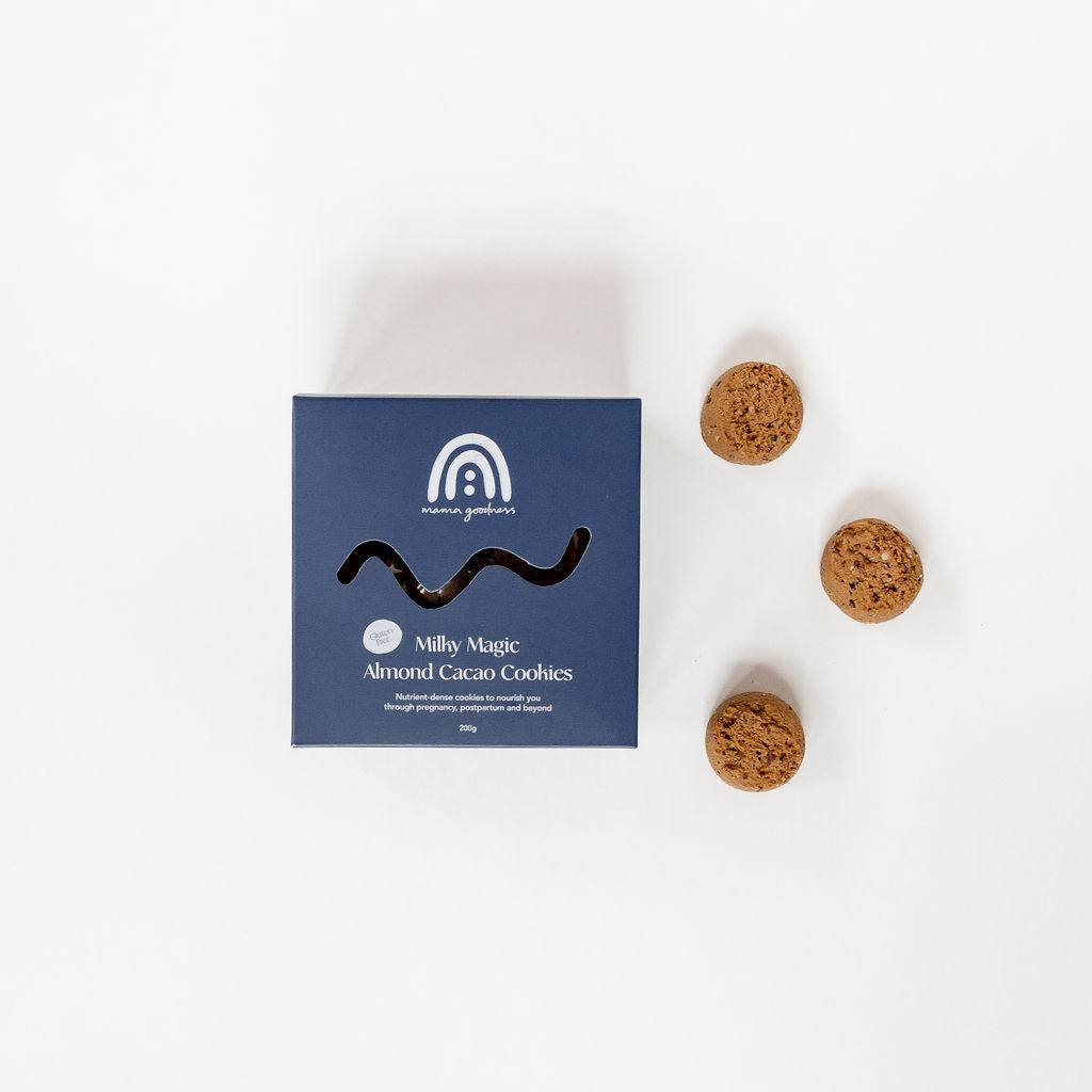 A box of Mama Goodness gluten free milky magic almond cacao cookies next to a blue box.