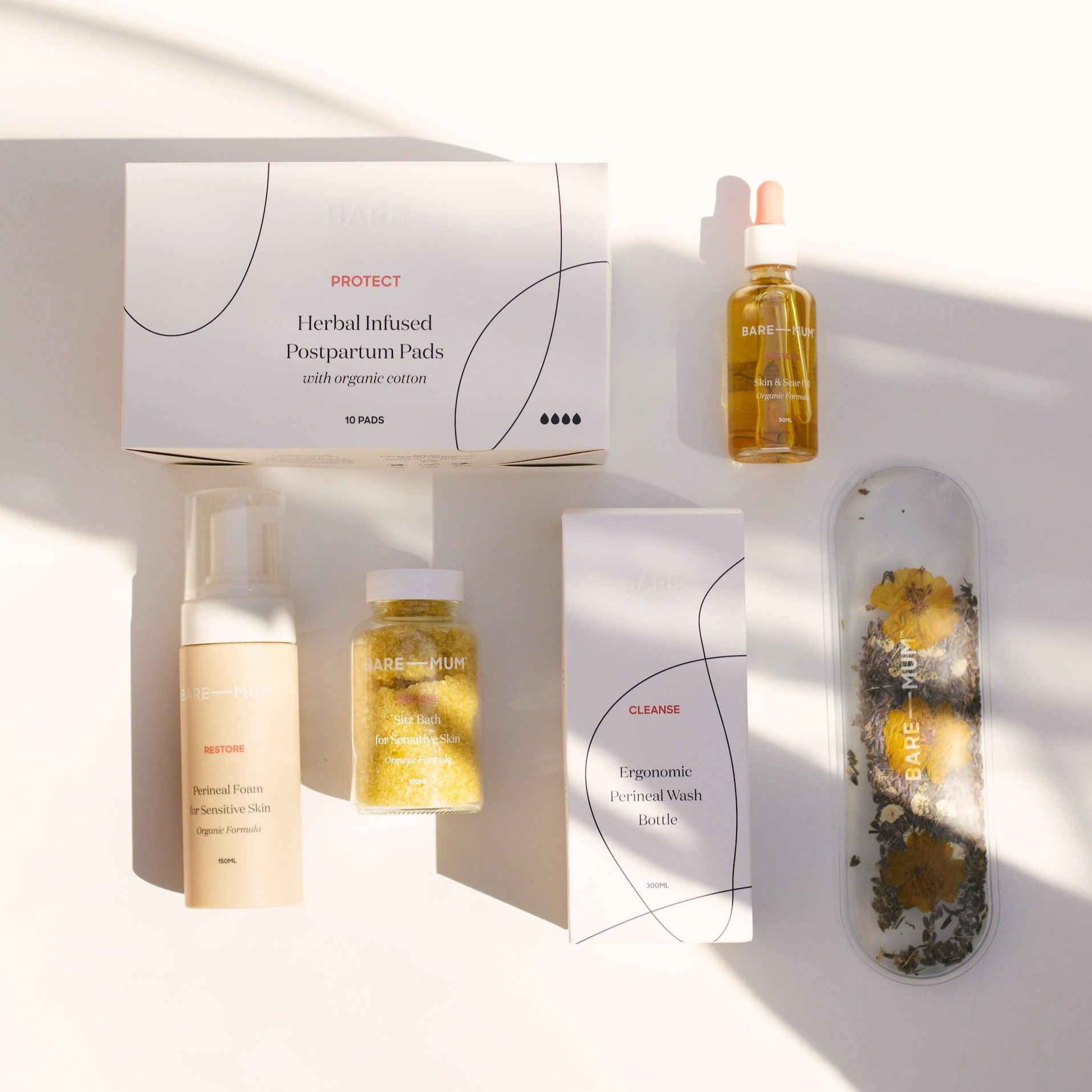A set of Bare Mum's postpartum recovery products on a white surface.