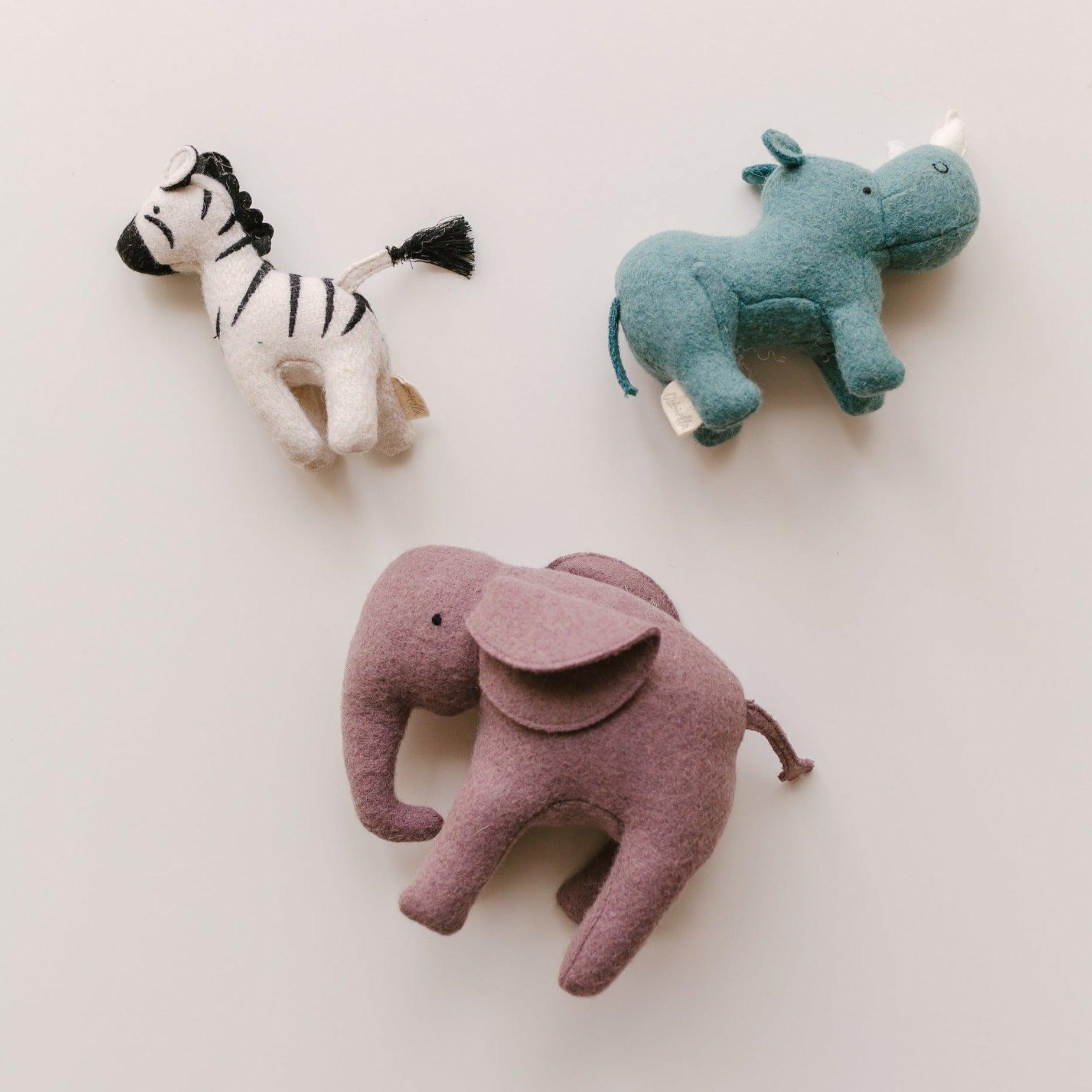 Olli Ella's Holdie Folk - Safari Animals are handmade safari-themed stuffed animals, including an elephant, zebra, and giraffe.