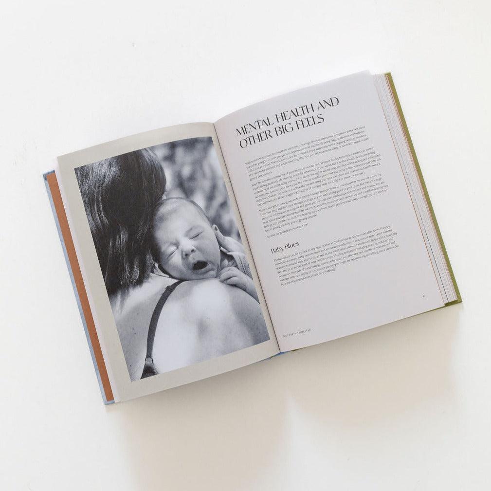 An open book with a photo of a baby from the Life After Birth by Jessica Prescott & Vaughne Geary.