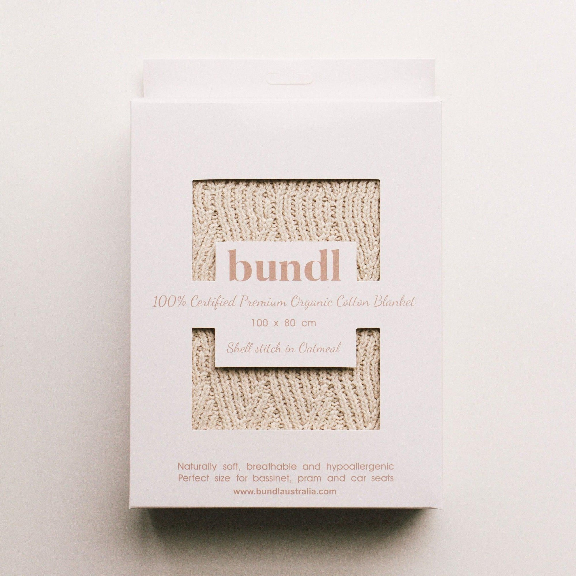 A white box with the word Bundl. on it, containing an Organic Cotton Blanket.