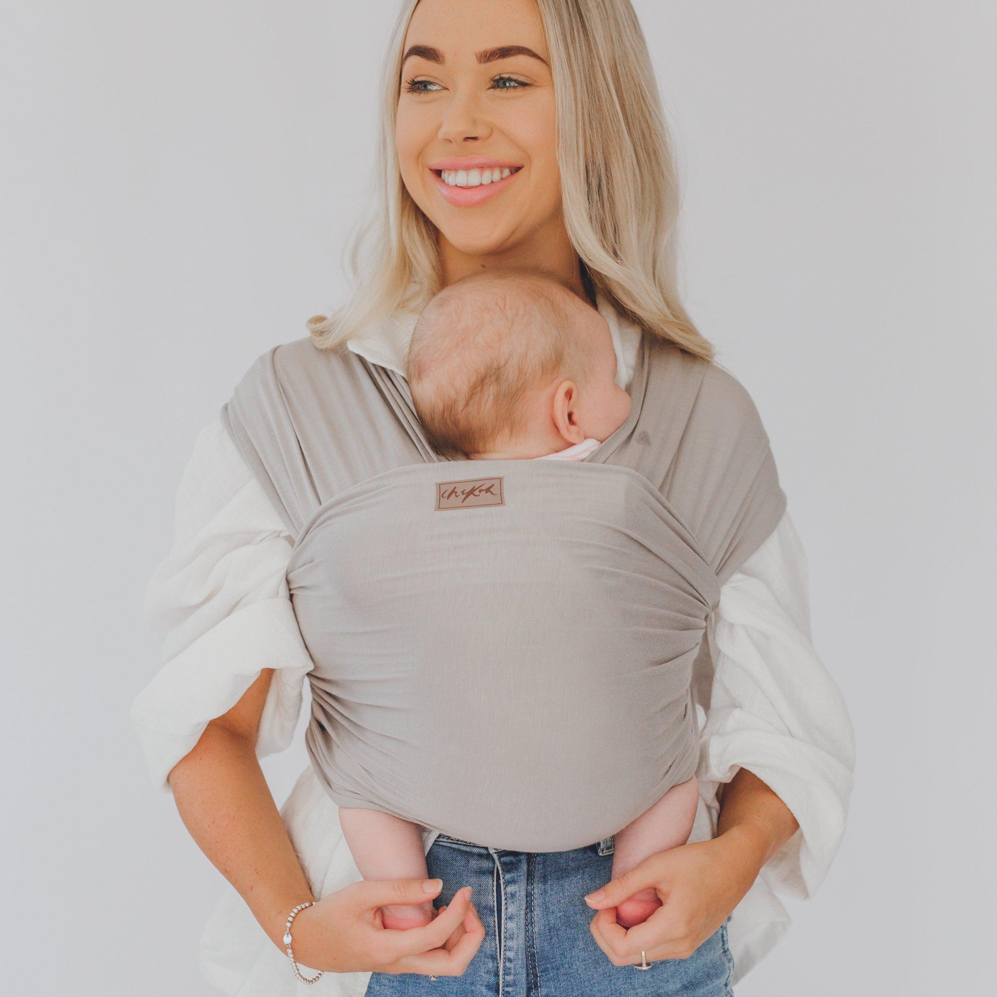 The Asha Wrap is a soft grey, the best carrier to compliment any look or style. Made from our exclusive, in house bamboo/spandex fabric blends.Completely adjustable for comfortable fit for any size - exclusive fabric will mould perfectly to the contours of your body & your baby.