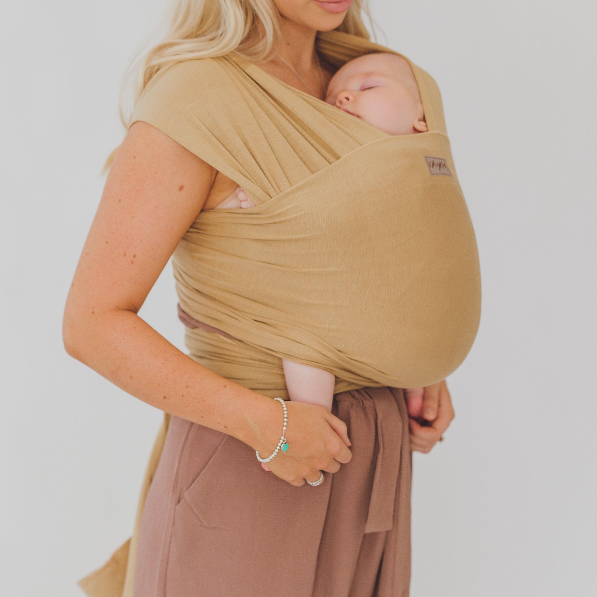    The Camel Wrap is a gorgeous warm/gold camel. Made from our exclusive, in house bamboo/spandex fabric blends.Completely adjustable for comfortable fit for any size - exclusive fabric will mould perfectly to the contours of your body & your baby.