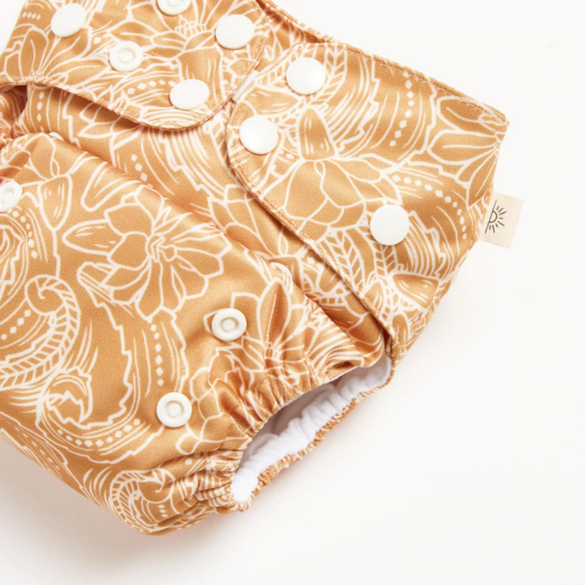 A close up of modern cloth diaper with a native print from EcoNaps in the shade Desert Cactus.