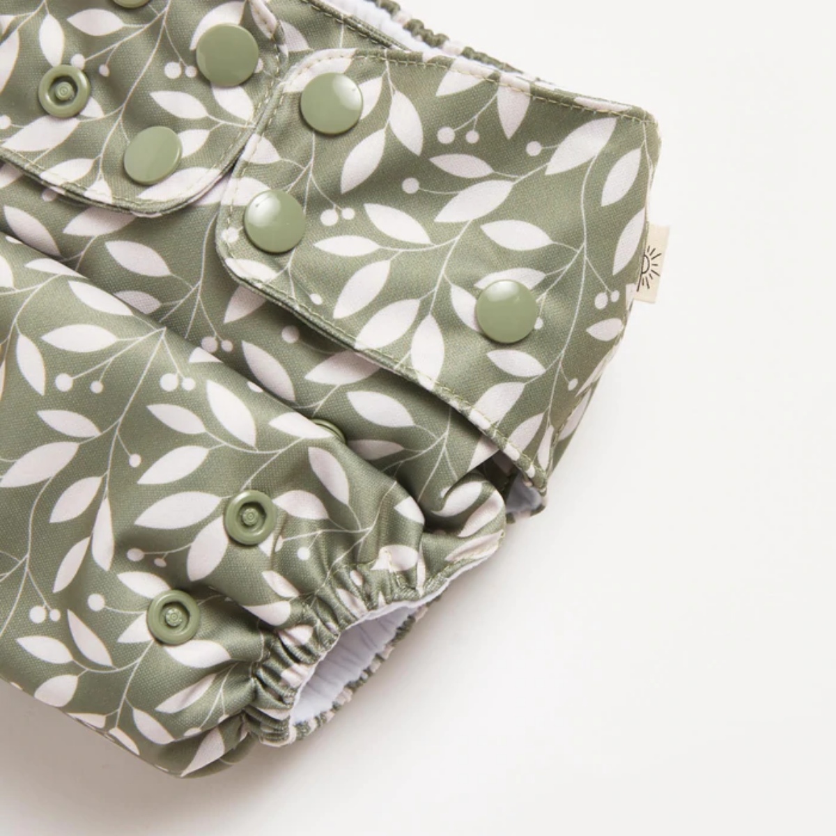 A close up of Sage 2.0 Modern Cloth Nappy by EcoNaps on a white surface.