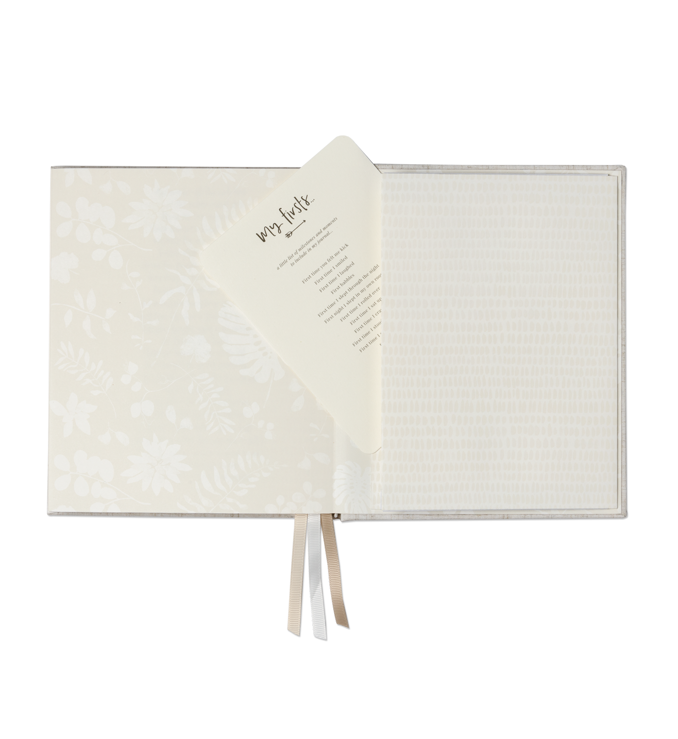 Open pages of the Emma Kate Co. little dreamer baby journal on a transparent surface.