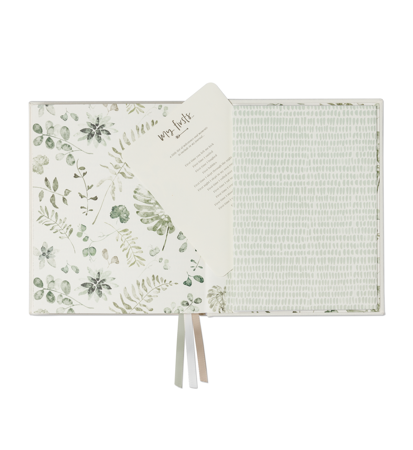Open pages of the Emma Kate Co. little dreamer baby journal in sage on a transparent surface.