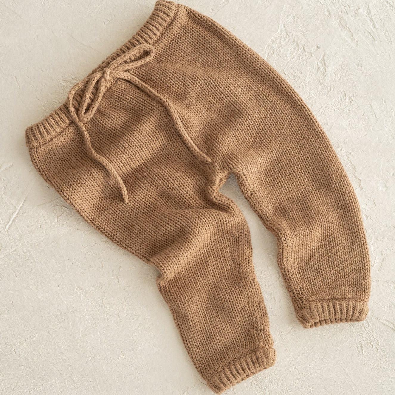 A baby's illoura poet pants in chocolate by Illoura the Label.