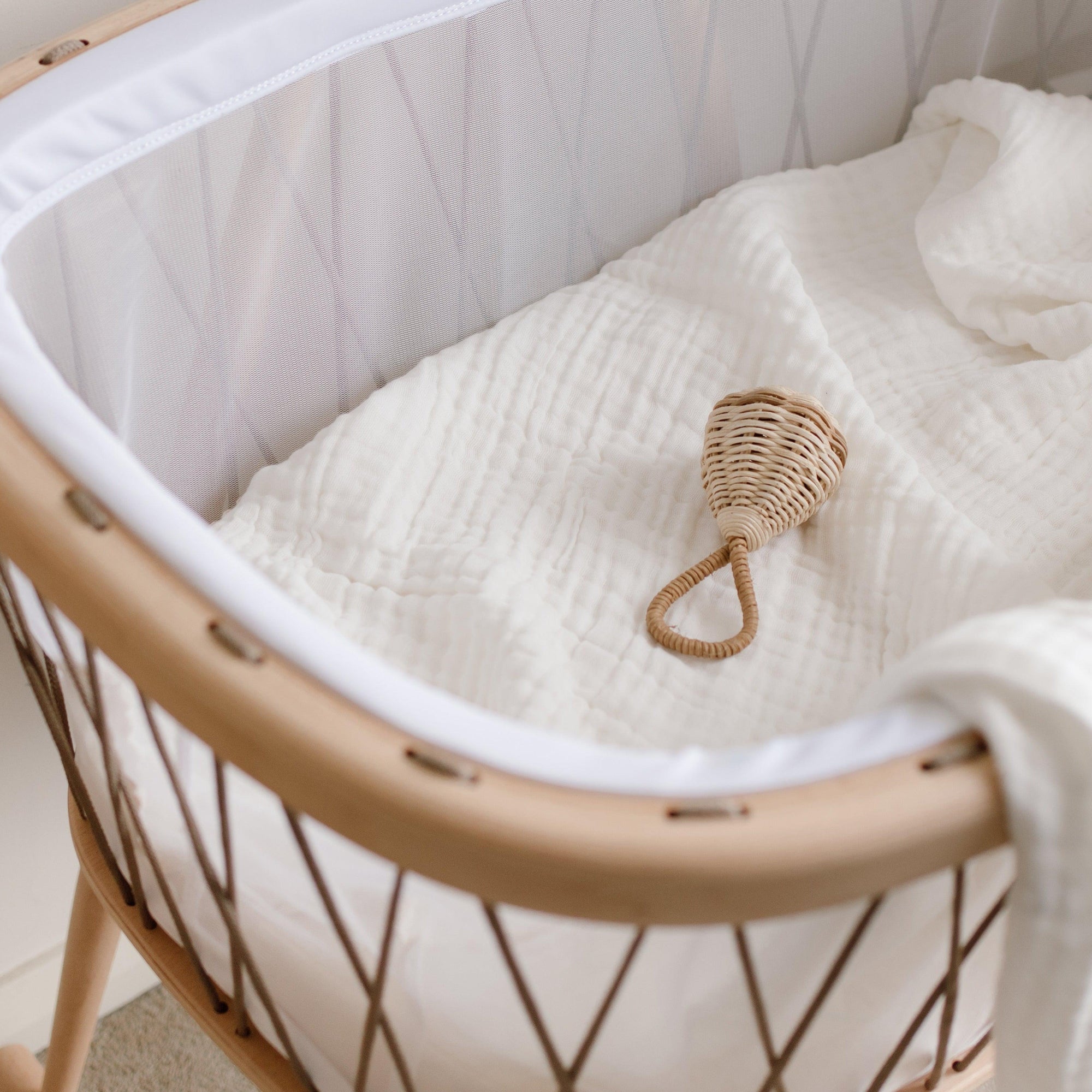 The Raya Rattle is handmade from 100% natural Rattan and has the loveliest of jingles from the bell inside. Beautiful and tactile, use your favourite natural fibres to hang the Raya Rattle from the handle of our Lyra Moses Basket to keep your little one entertained. A piece that will surely be treasured for years to come. 