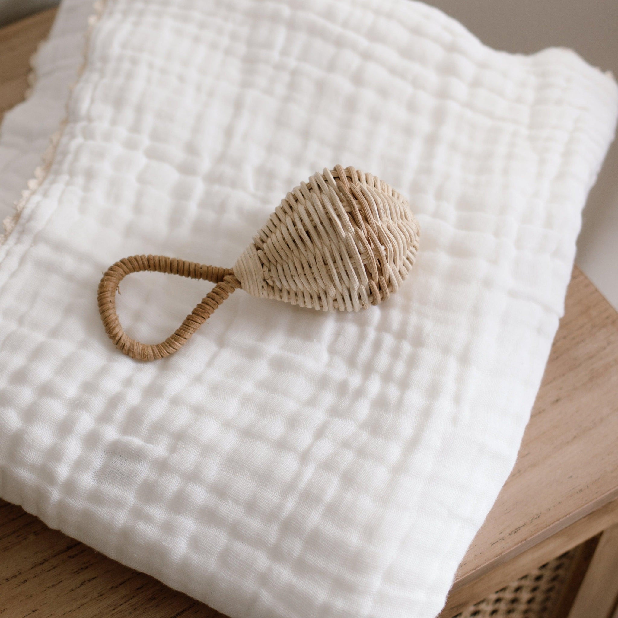 The Raya Rattle is handmade from 100% natural Rattan and has the loveliest of jingles from the bell inside. Beautiful and tactile, use your favourite natural fibres to hang the Raya Rattle from the handle of our Lyra Moses Basket to keep your little one entertained. A piece that will surely be treasured for years to come. 