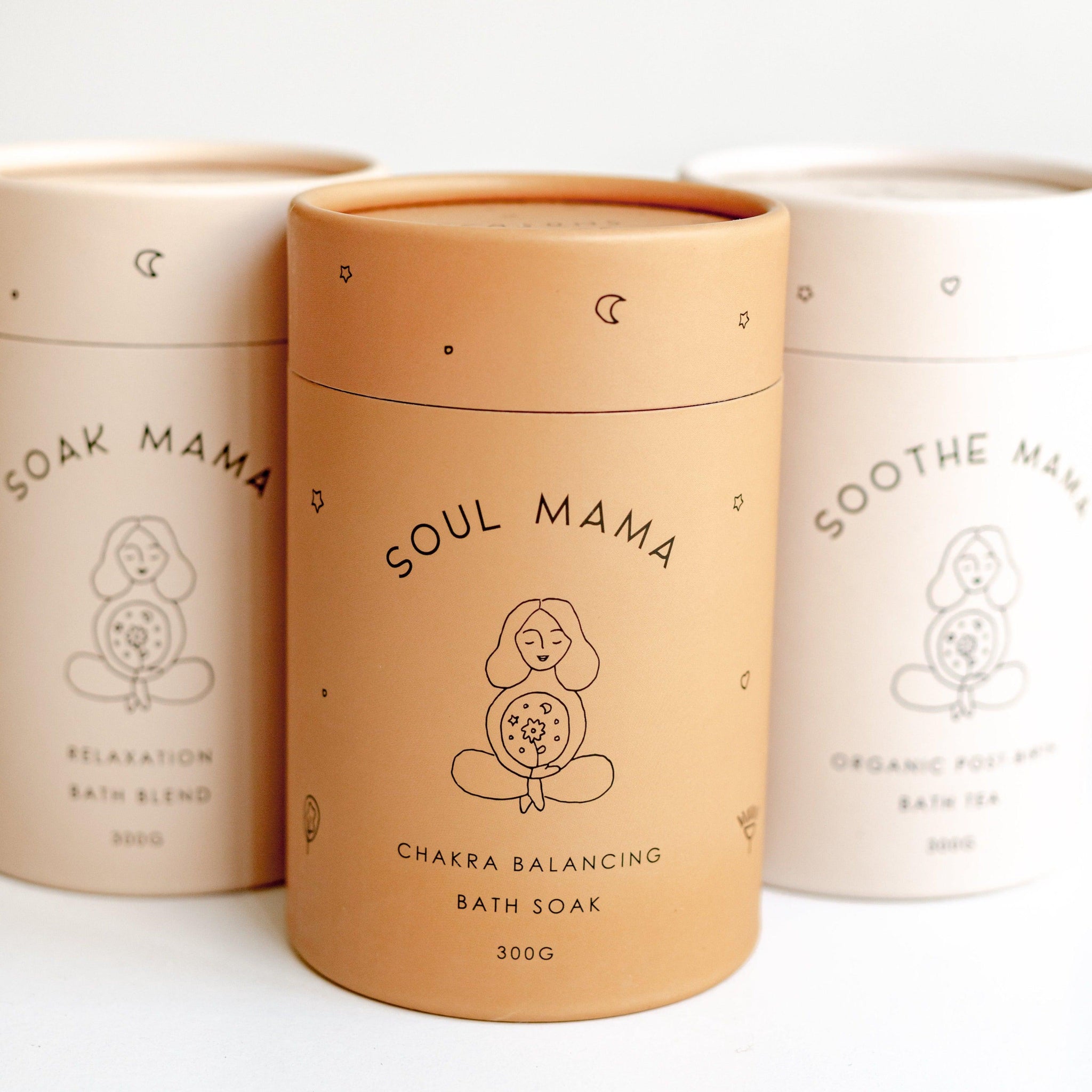 Three tins featuring Seasons of Mama Soak Mama Relaxation Bath Blend, Soul Mama Chakra Balancing Bath Soak and Soothe Mama Bath Tea. 