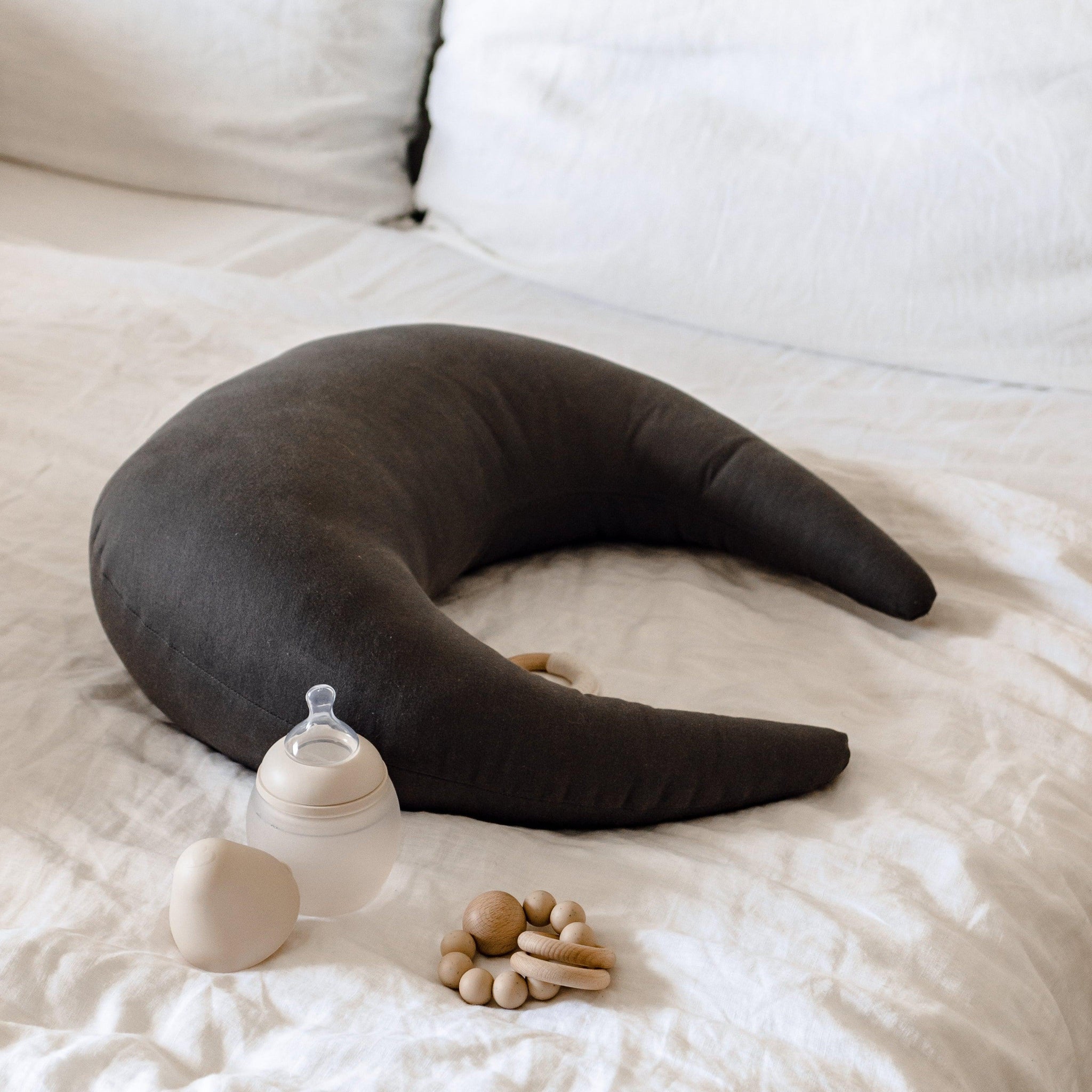 A PREORDER Sparrow Feeding & Support Pillow with a bottle on it.